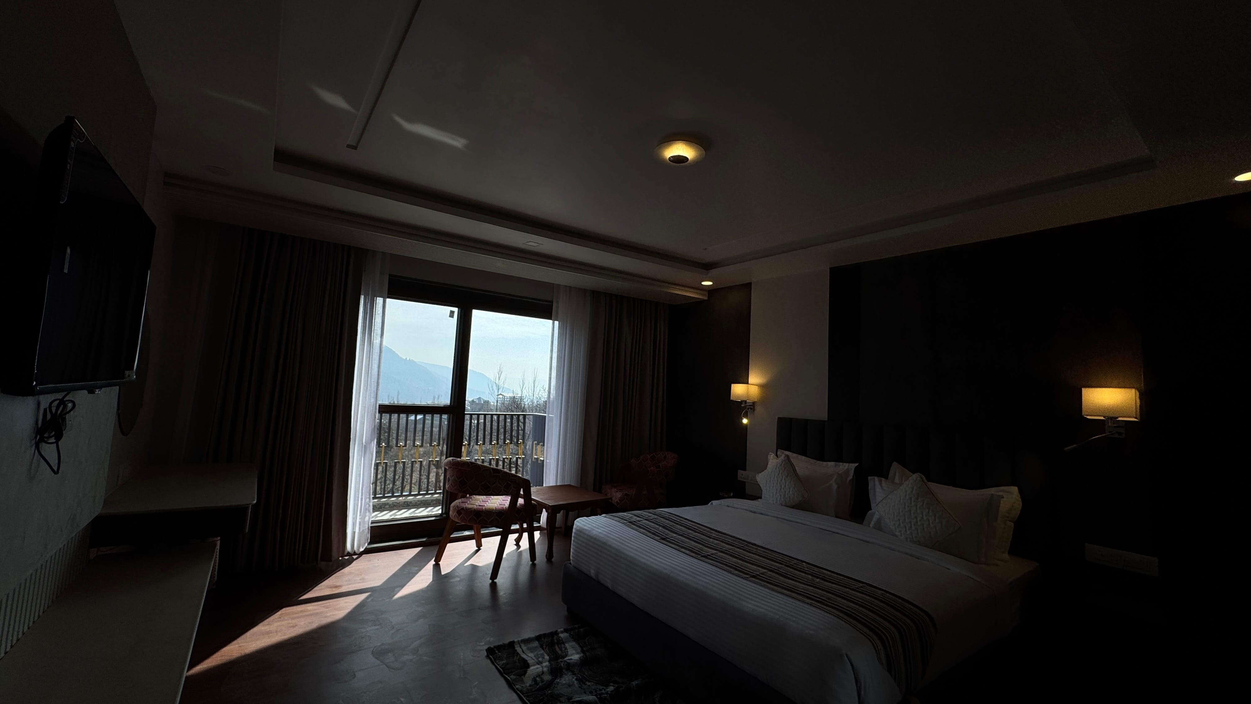 Room at evening with mountain view through balcony