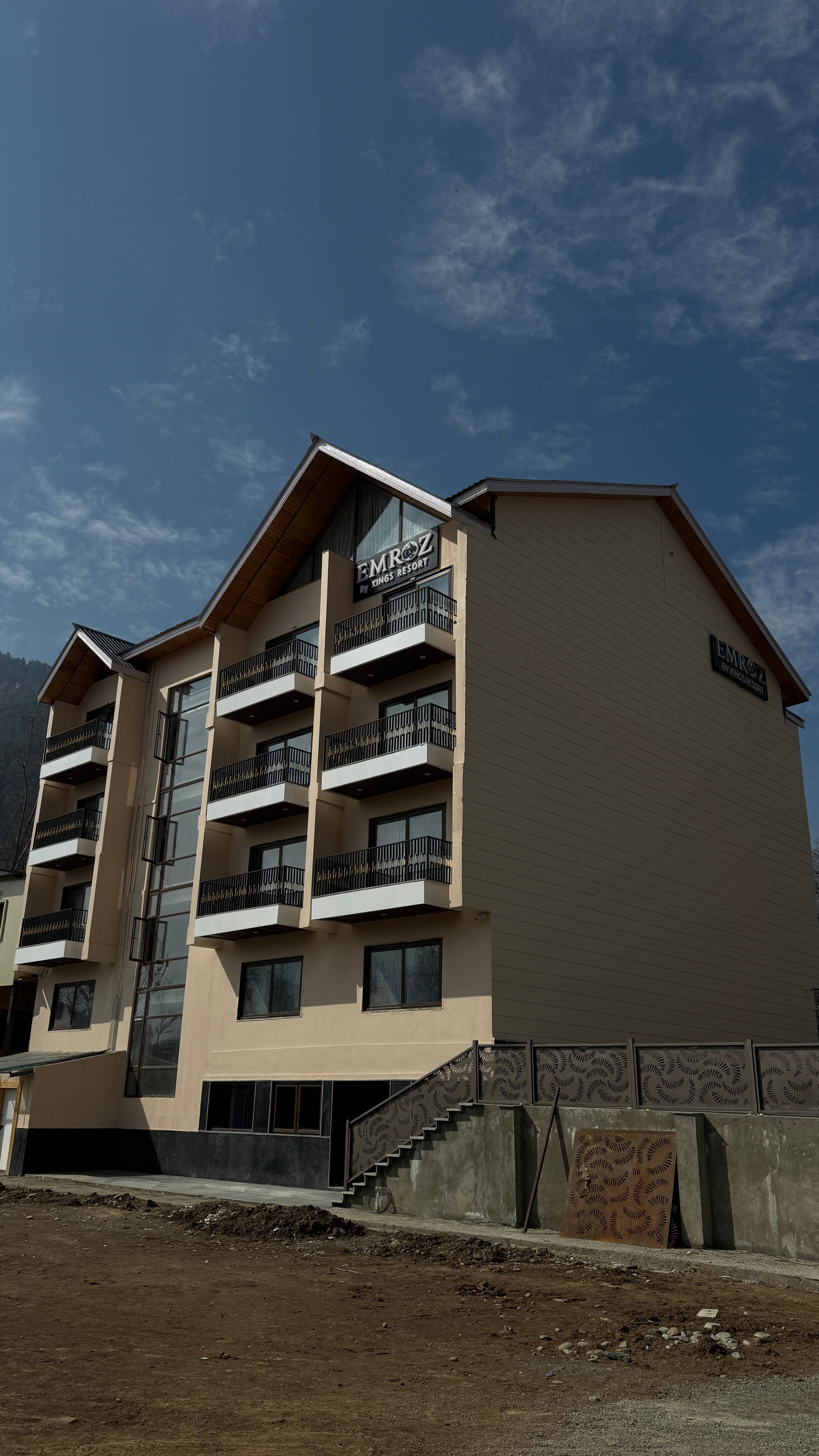 Emroz by Kings Resort building exterior from a different angle with mountain scenery