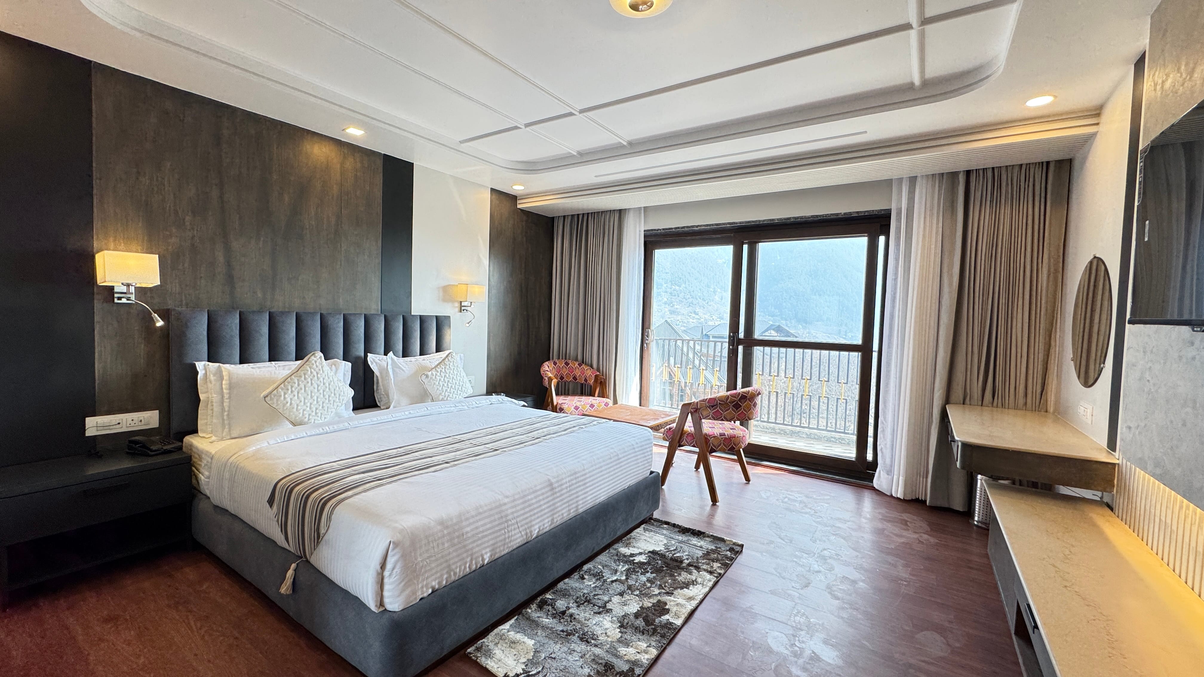 Premium room at Emroz by Kings Resort with mountain view balcony and elegant furnishings